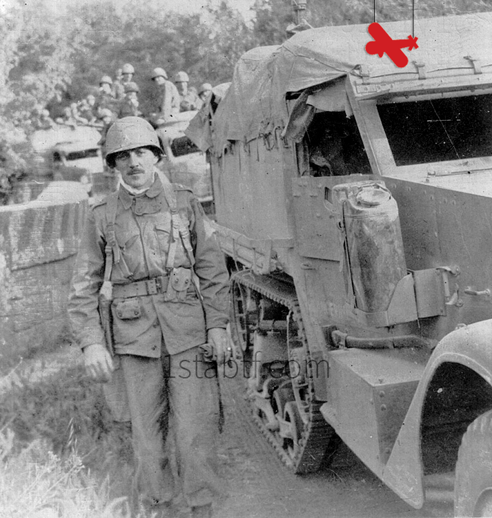 General Robert T. Frederick sided by his half-track on the "race to Rome". Identity of his driver is still unknown. Behind him in a truck are members of the 6-3. The picture was probably took on the 3 or 4 of June 1944.